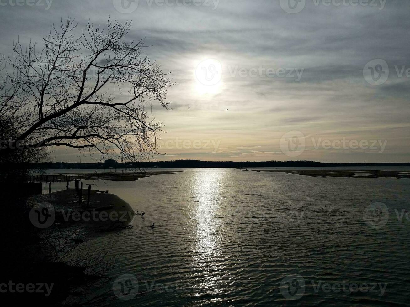 birds and airplane and Potomac river during sunrise photo