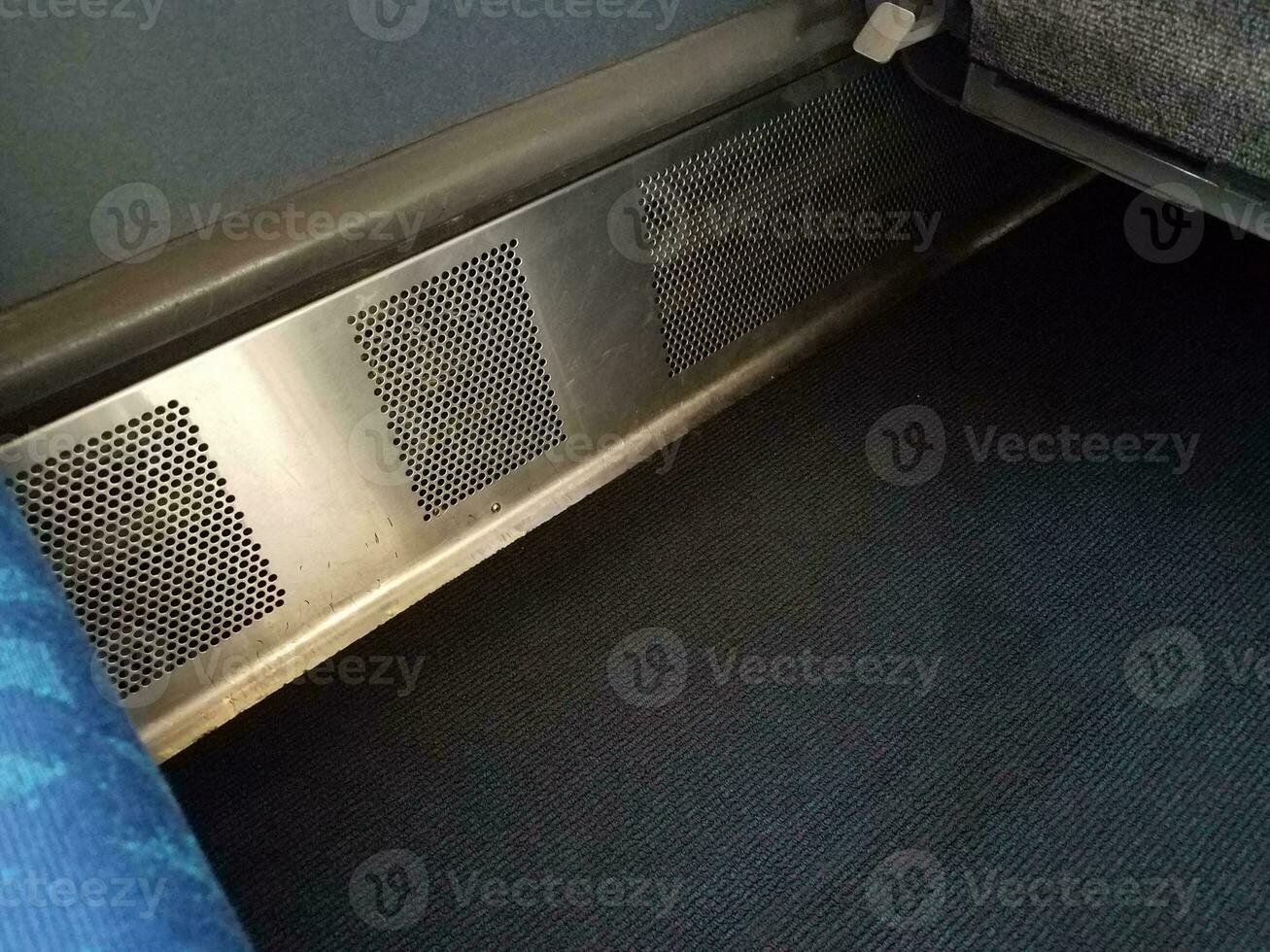 metal heater with holes in train with carpet photo