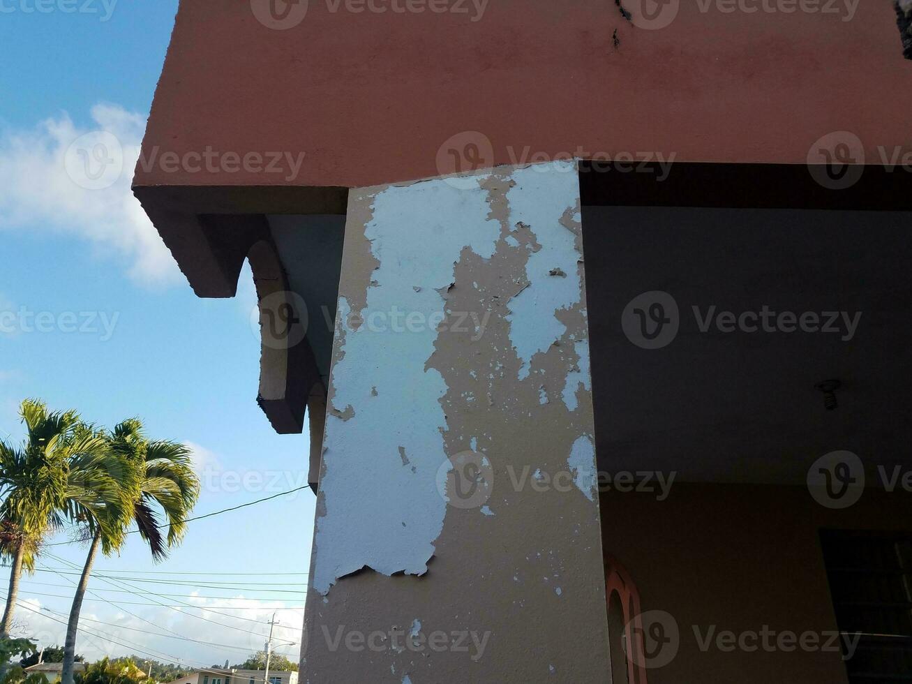 house with chipped and peeling paint in Puerto Rico photo