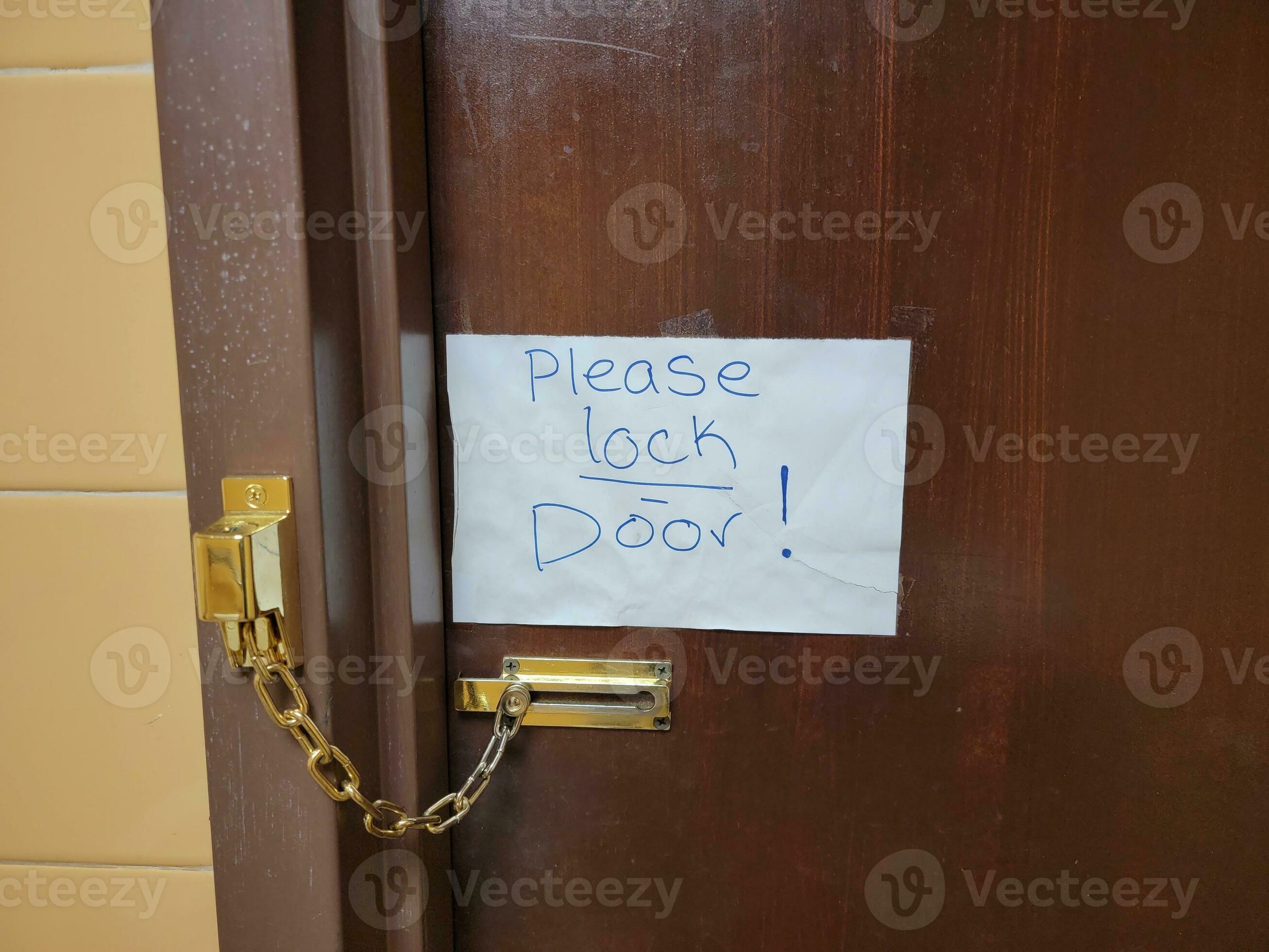 please lock door note on bathroom door with chain 8202857 Stock