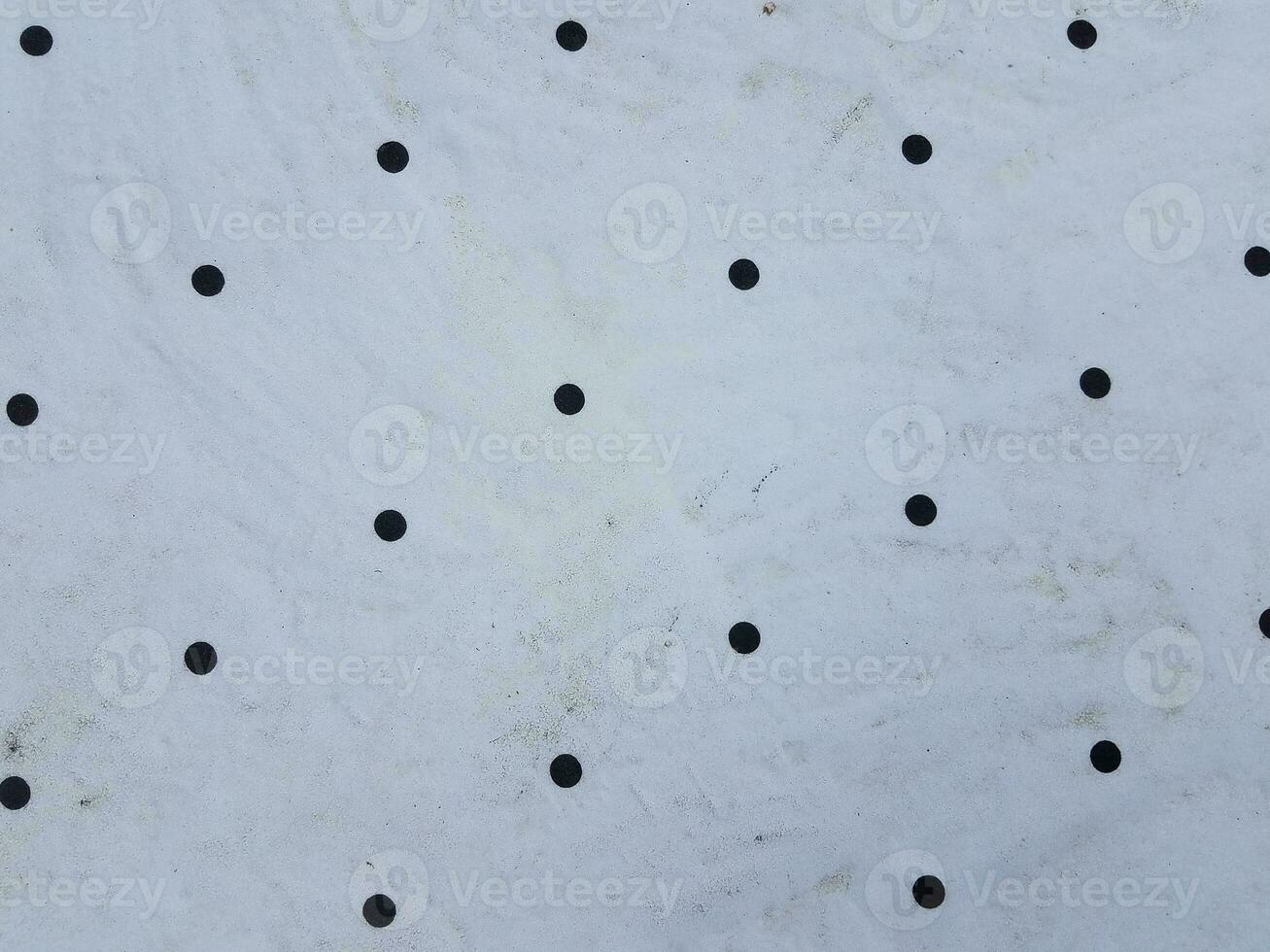 white metal with holes in it photo