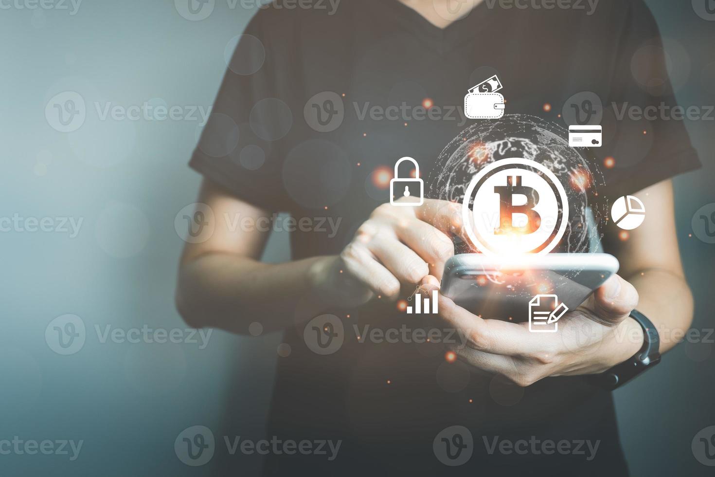 Businessman using smart phone to do online transactions with blockchain technology, cryptocurrencies, bitcoin, global data connection concept, big data security and a cashless society. photo