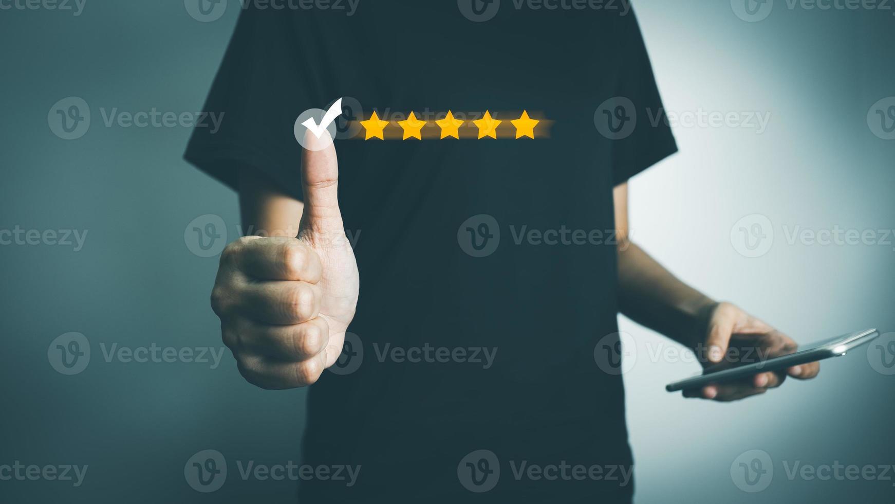 Customer satisfaction rating with smartphone, Thumbs up excellent service, Review the highest rated 5 stars, Impressed very good service, the best attention, feedback from guest. photo