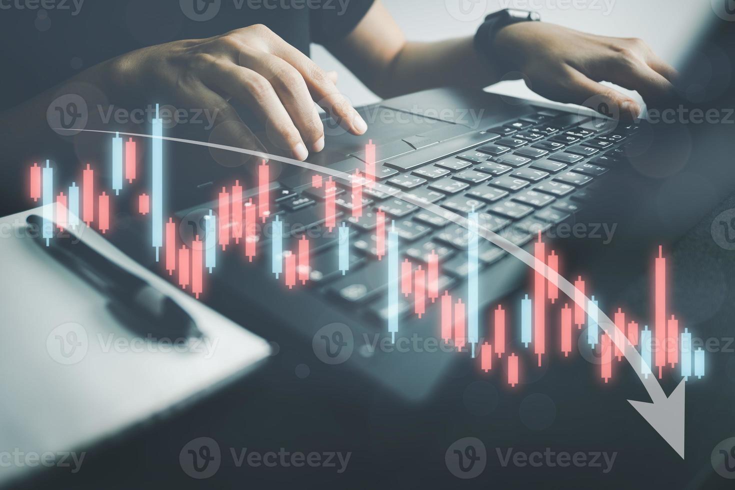 Investor analyze stock chart with laptop, businessman forecast and analysis graph in Bearish downtrend, economic slowdown, inflation crisis, loan interest rise, trade war finance, covid-19 impact. photo