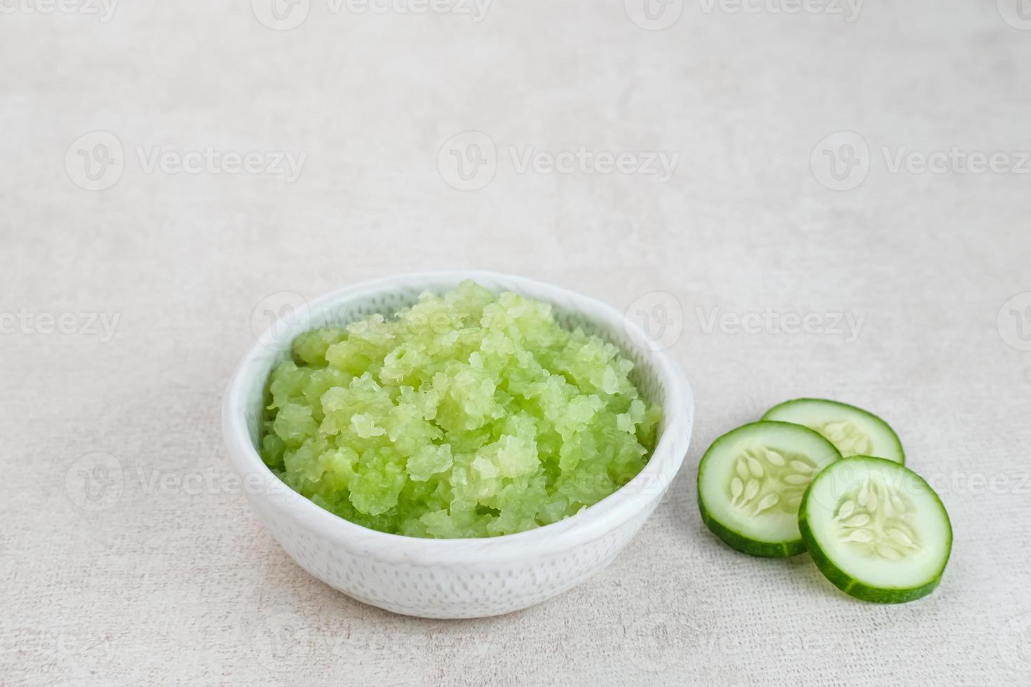 Organic cucumber pulp juice, squeezed from a slow juicer, can be used as a face mask, zero waste. Selected focus. photo