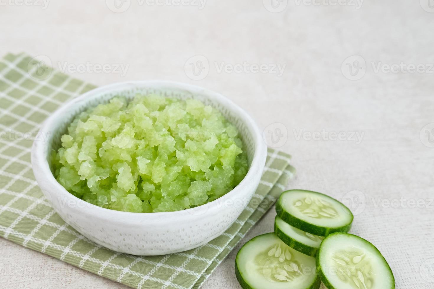 Organic cucumber pulp juice, squeezed from a slow juicer, can be used as a face mask, zero waste. Selected focus. photo