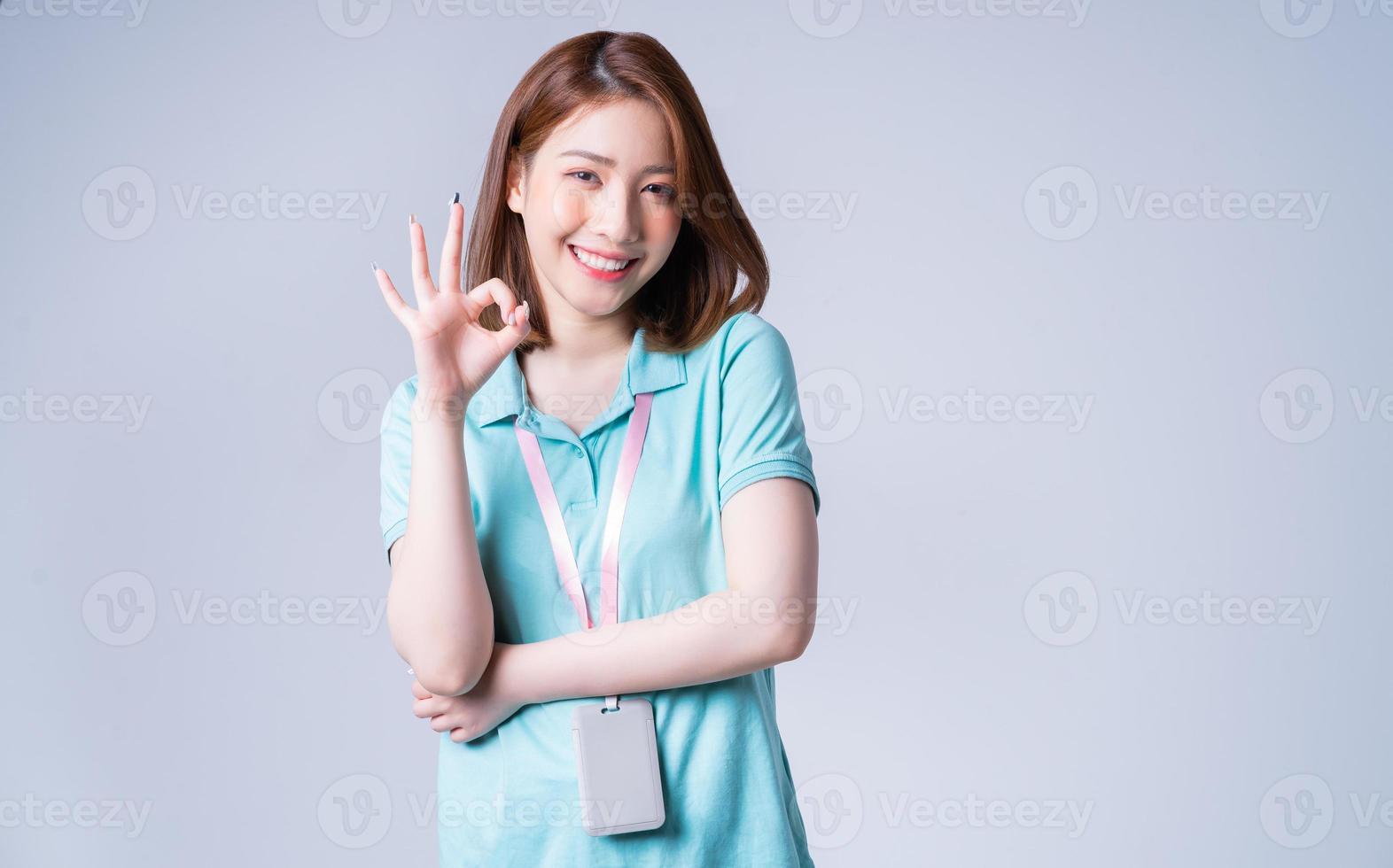 Portrait of young Asian businesswoman on white background photo