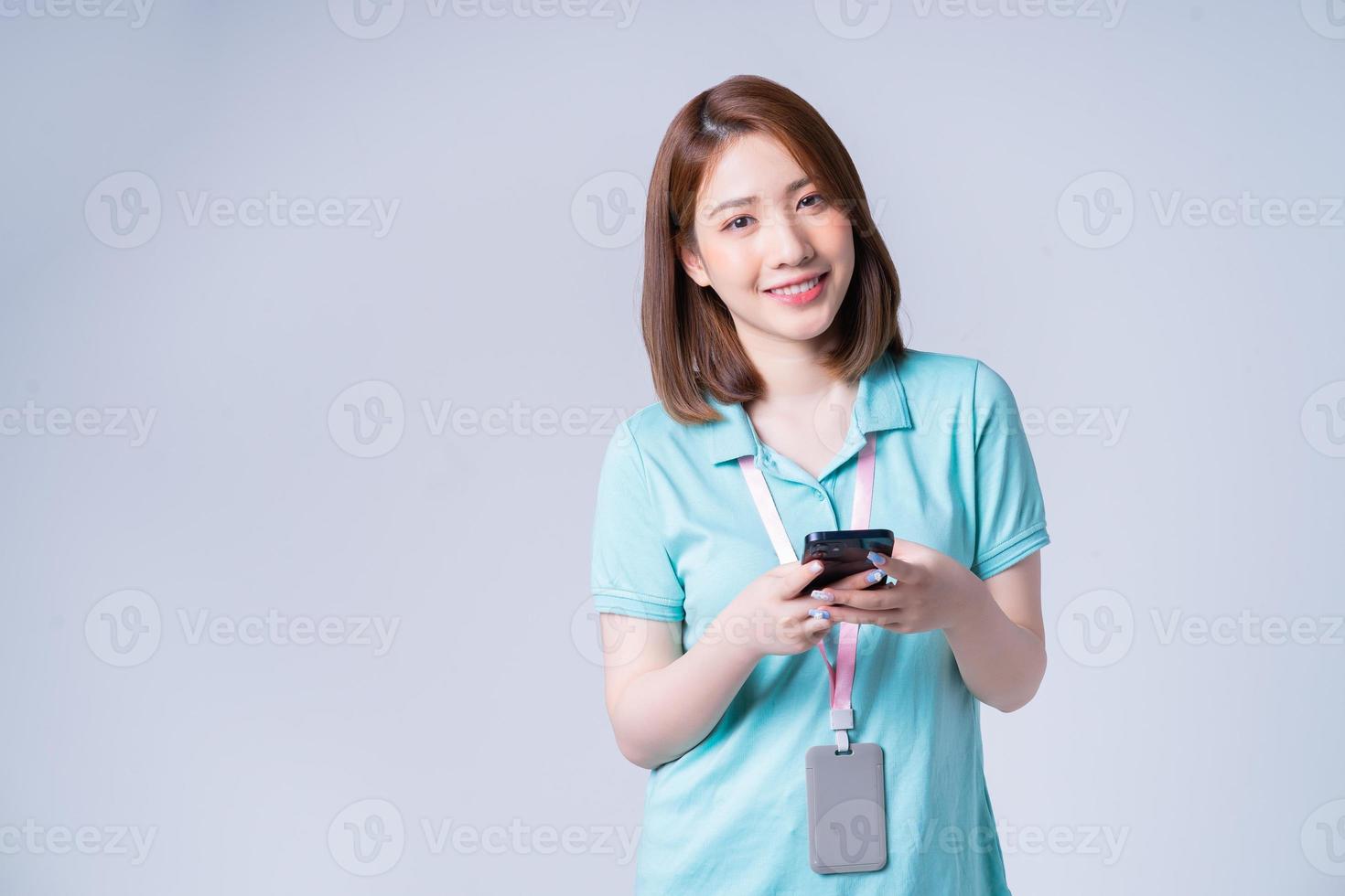 Portrait of young Asian businesswoman on white background photo