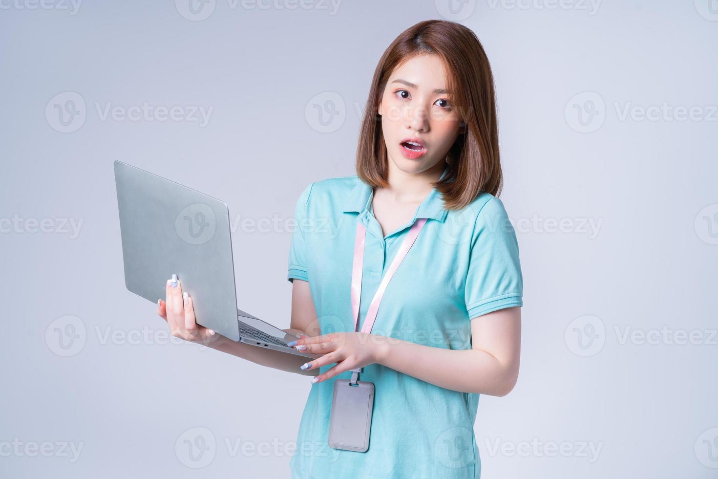 Portrait of young Asian businesswoman on white background photo