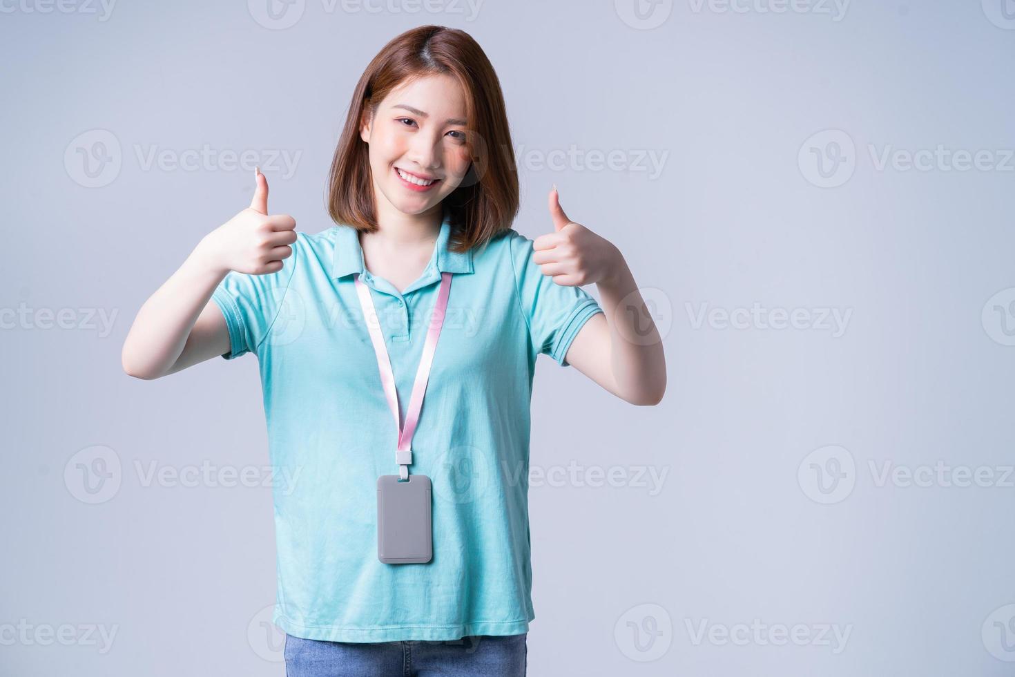 Portrait of young Asian businesswoman on white background photo