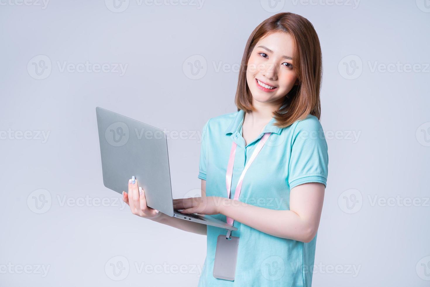 Portrait of young Asian businesswoman on white background photo
