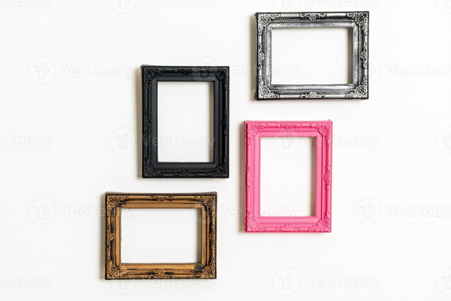 empty picture frame on white wall background photo