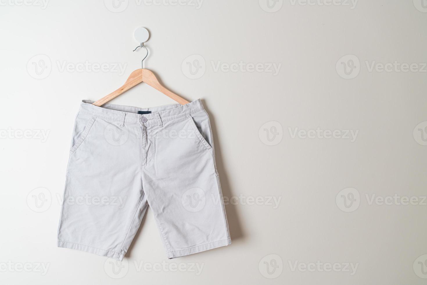 short pants hanging on wall photo