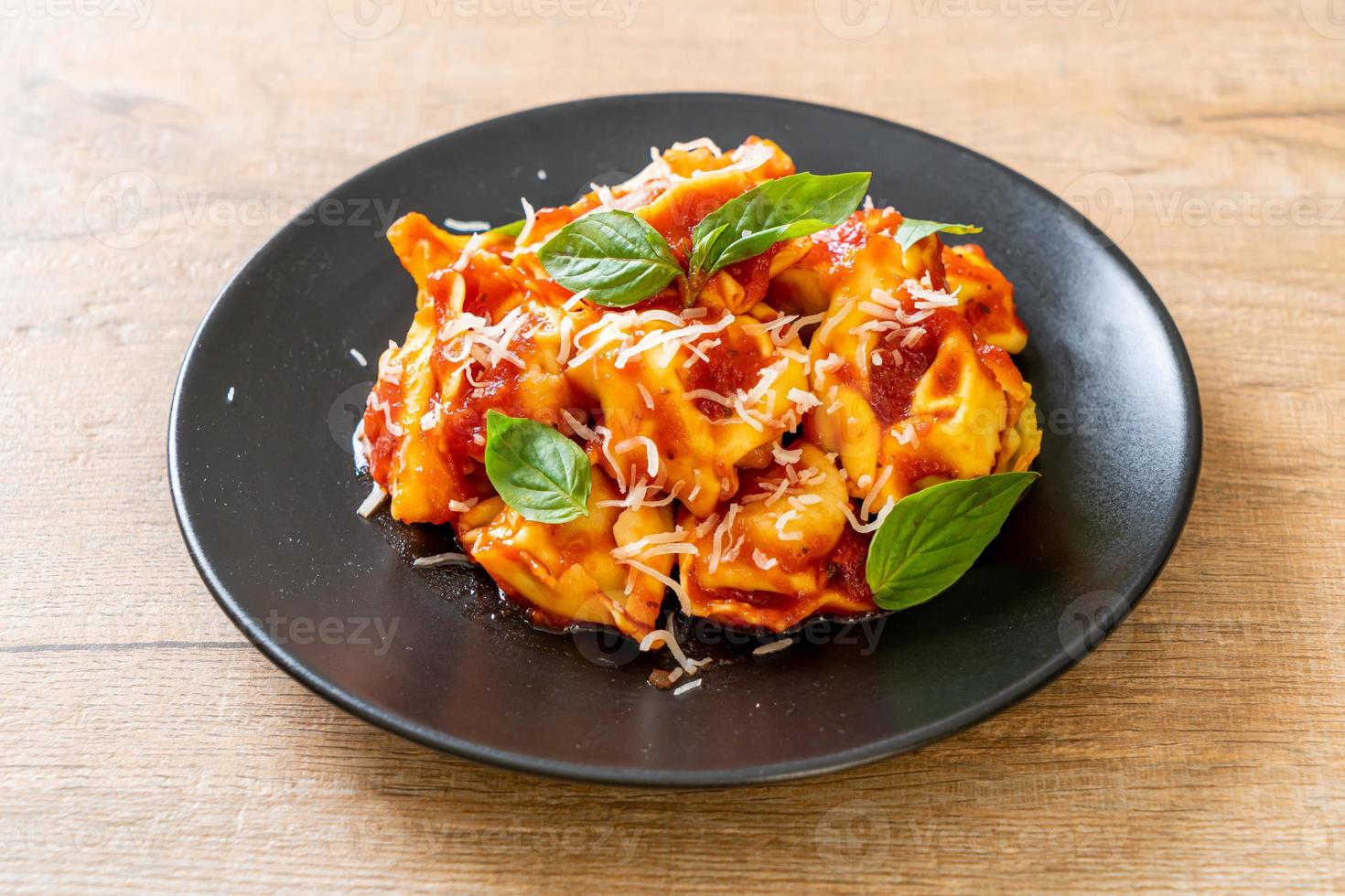 Italian tortellini pasta with tomato sauce photo