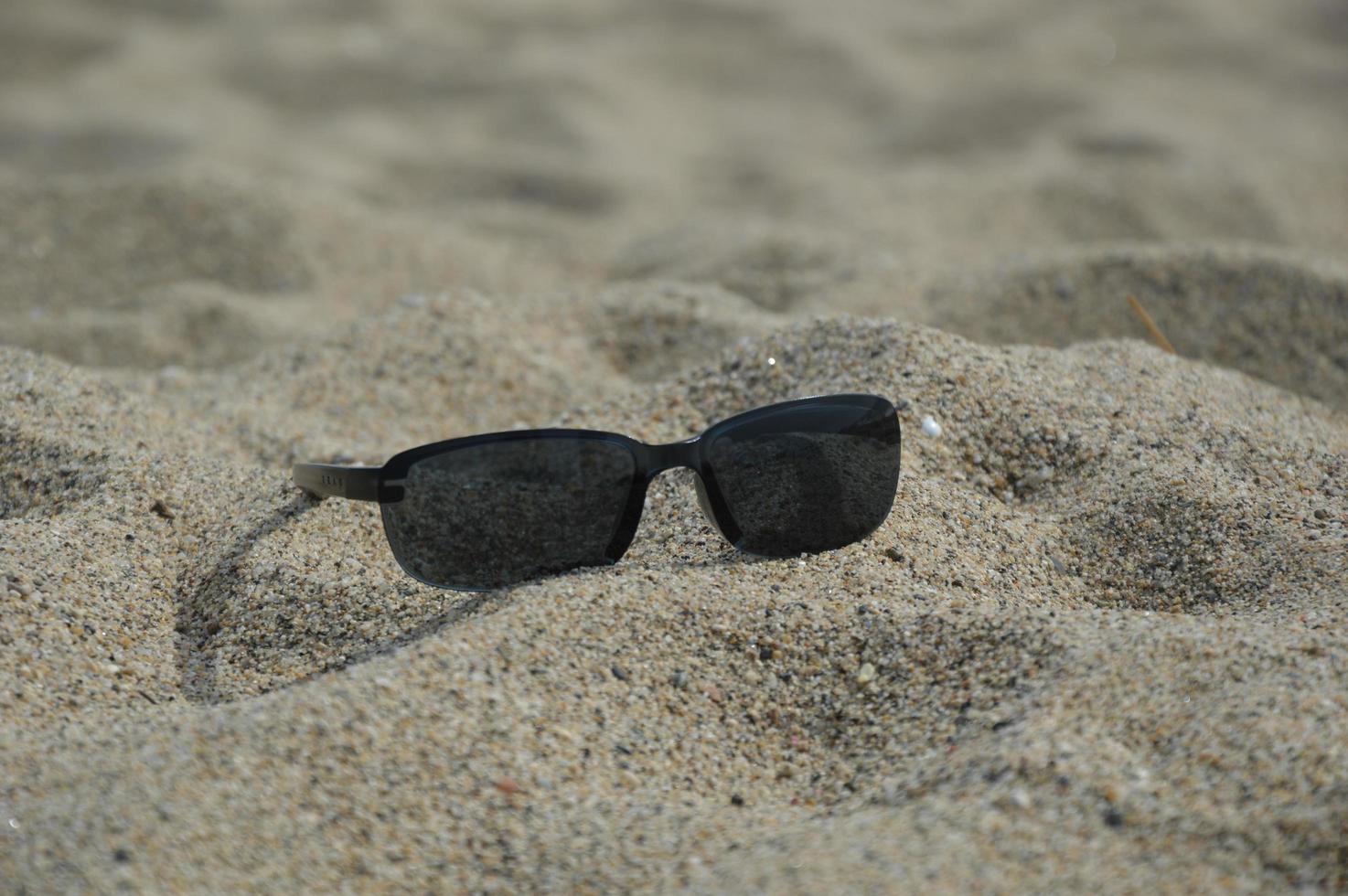 Sunglasses on the beach photo