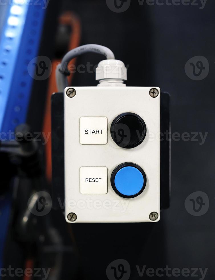Two buttons with the words START and RESET next to them photo