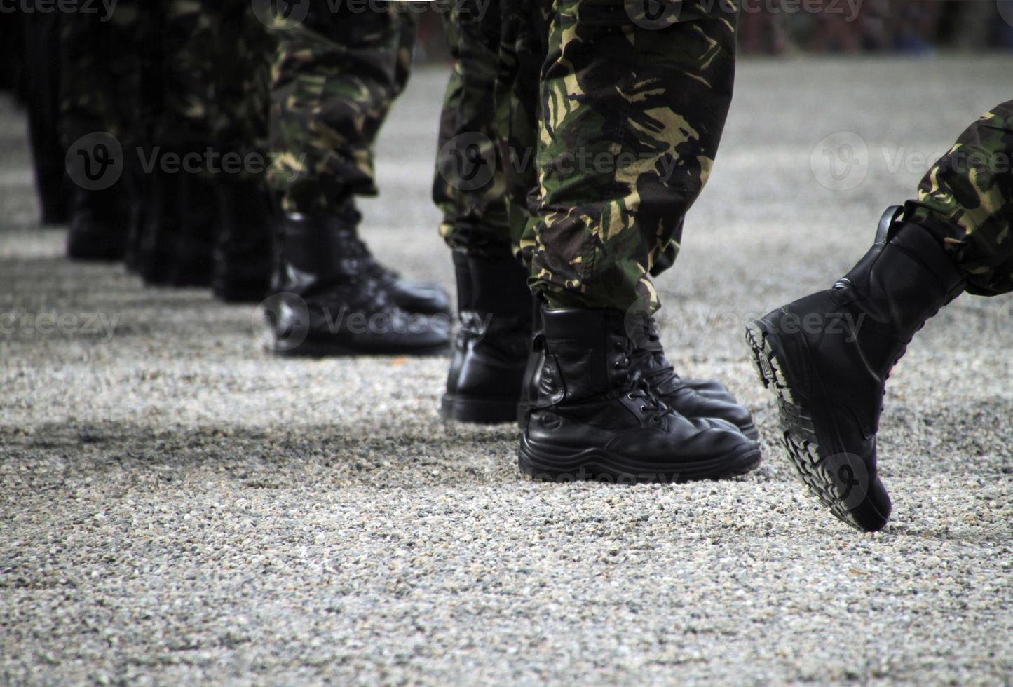 Soliders standing in a row at a military parade photo