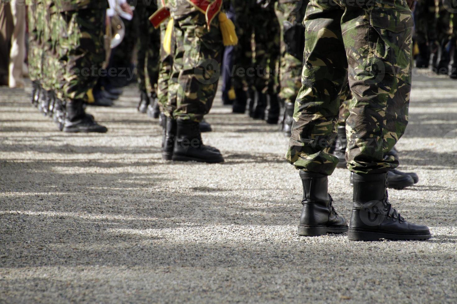 Soliders standing in a row at a military parade photo