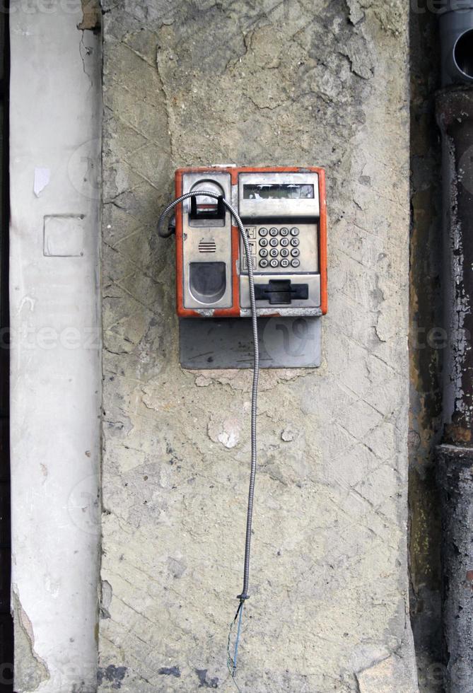 Lost connection - damaged old pay telephone photo