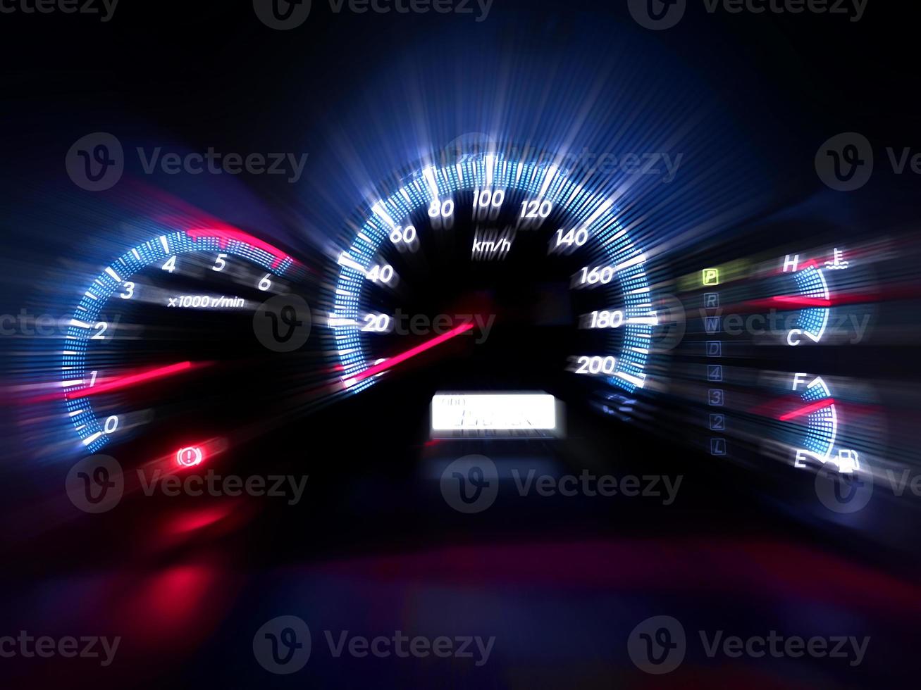 The speedometer of a modern car shows a high driving speed. Added motion blur photo