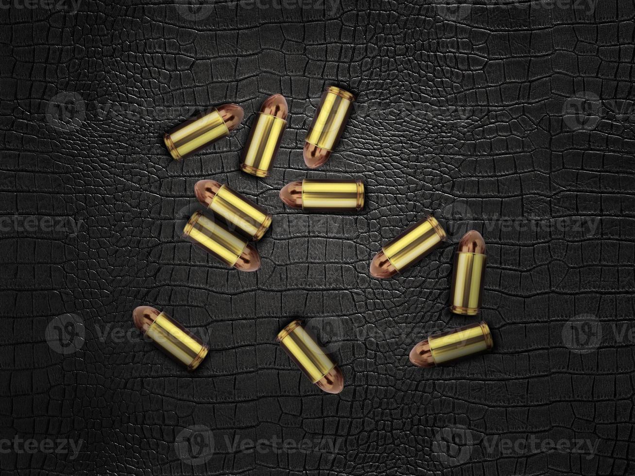 bullets on a black leather background photo