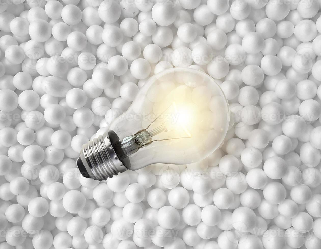 light bulbs on background of white circle styrofoam ball texture photo