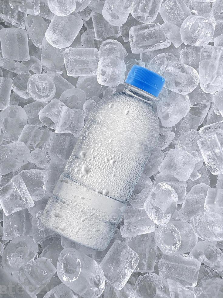 water bottle on ice cubes background photo