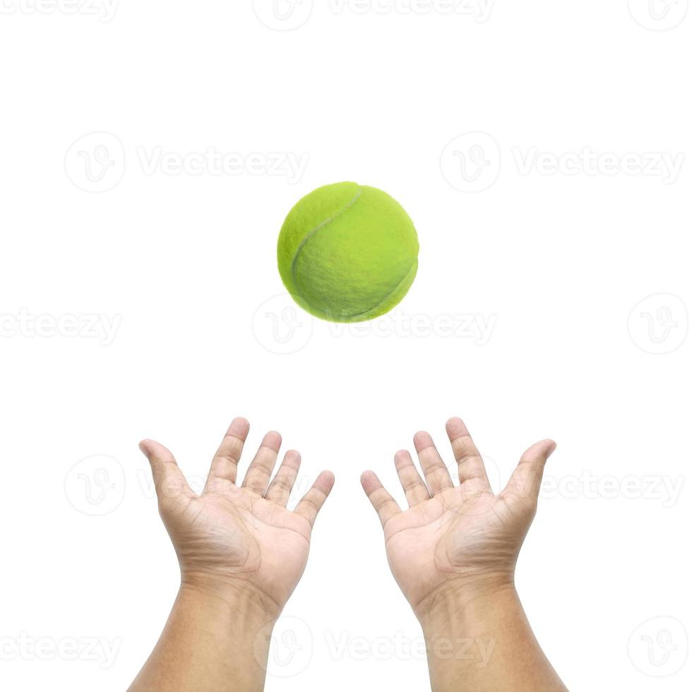 Hand holding tennis ball on white background photo