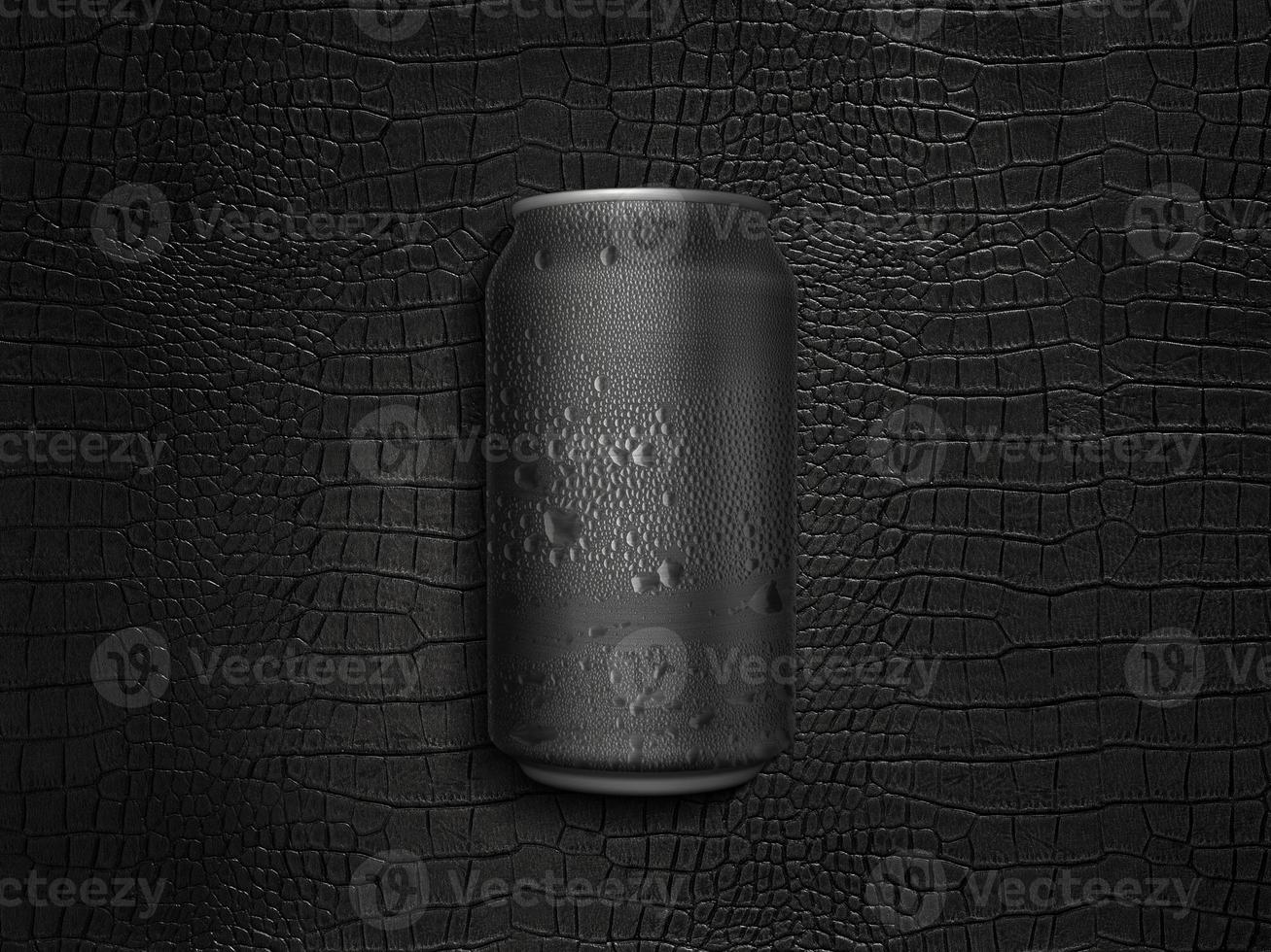 Can of cold beverage on a black leather background photo