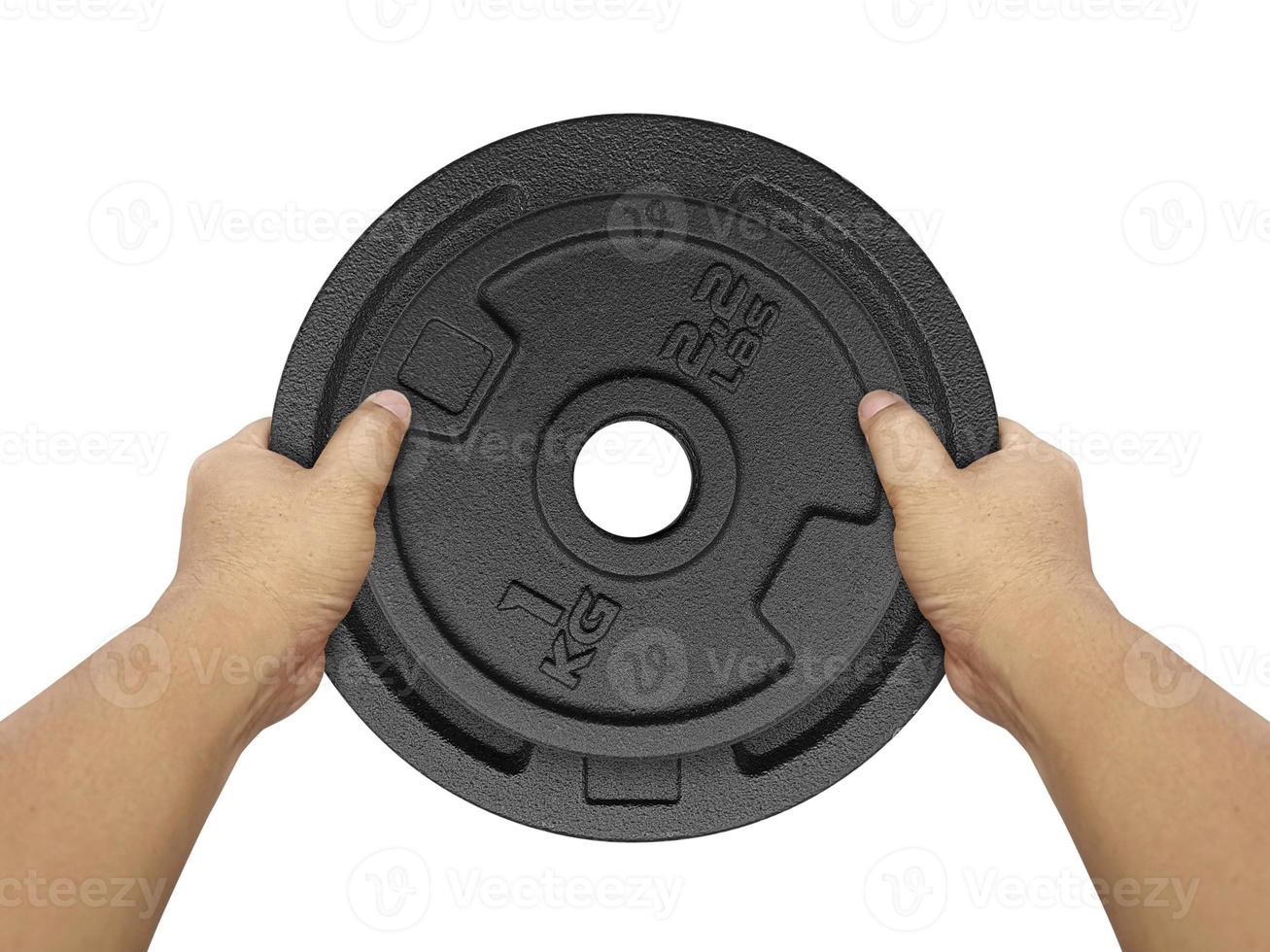 Hands holding Heavy weight plate isolated on white background photo