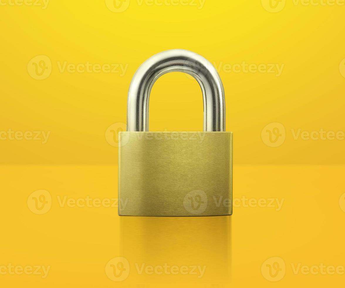 Locked Padlock on yellow background idea concept photo