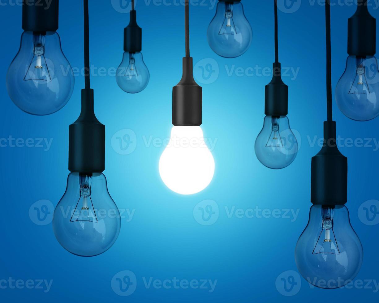 Idea idea with light bulbs on blue background photo