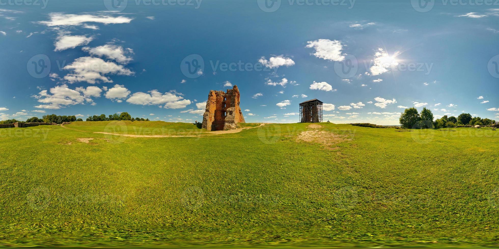 full 360 panorama in equirectangular equidistant spherical projection of destroyed the ancient medieval castle on a sunny summer day, skybox for VR content photo