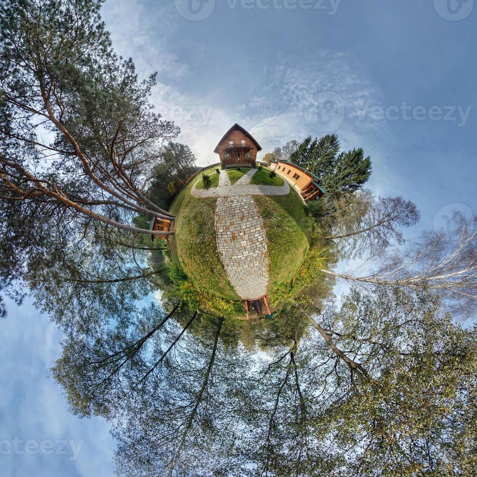 Little planet.  Spherical aerial view  in forest near vacation home in nice day with nice clouds photo