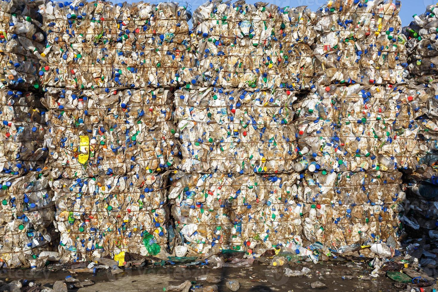 Plastic bales at the waste processing plant. Separate garbage collection. Recycling and storage of waste for further disposal. Business for sorting and processing of waste. photo