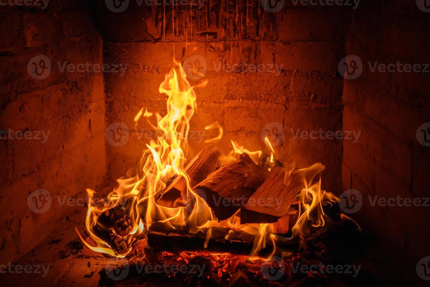 Fire flames in fireplace background photo