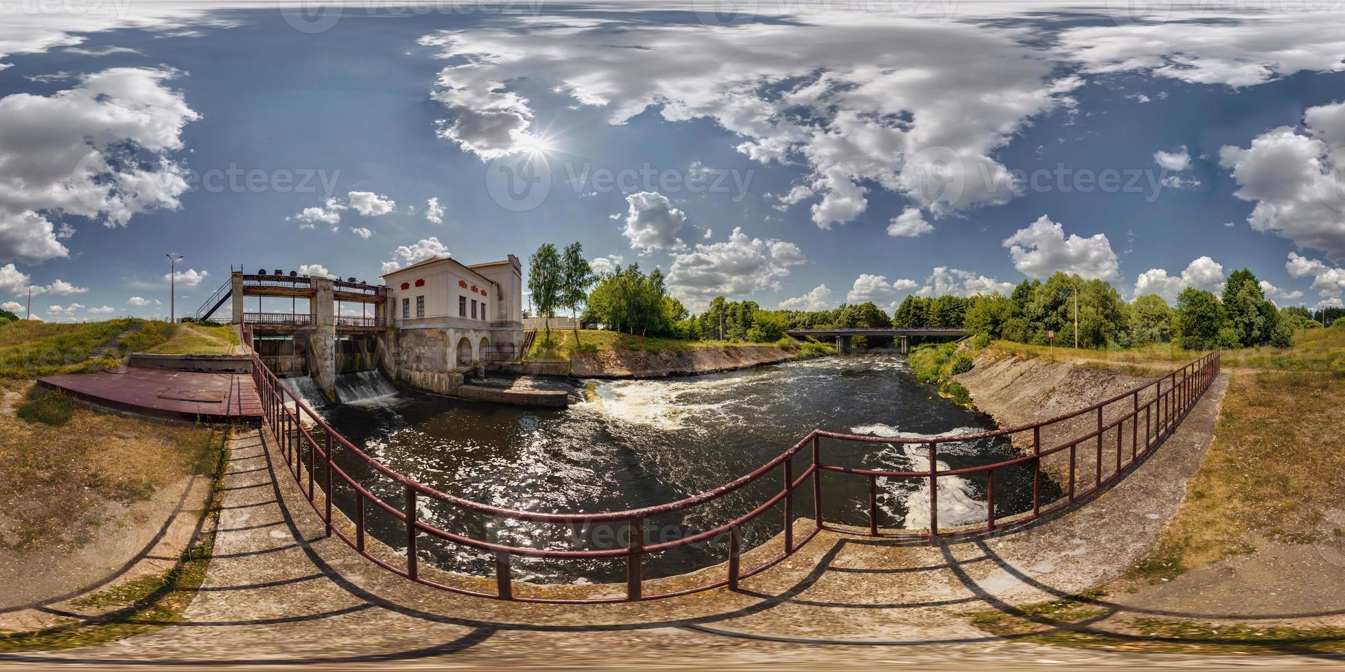 Mini hydro power plant on the lake on a sunny day. Full 360 degree panorama in equirectangular spherical projection photo