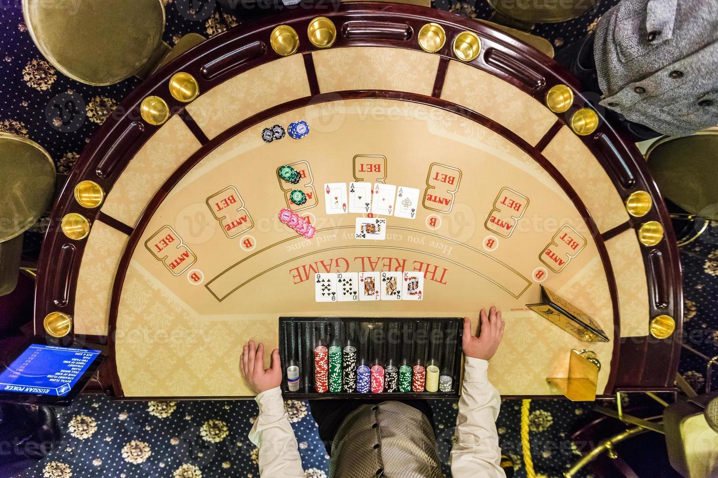 gambling chips and cards on a game table roulette photo