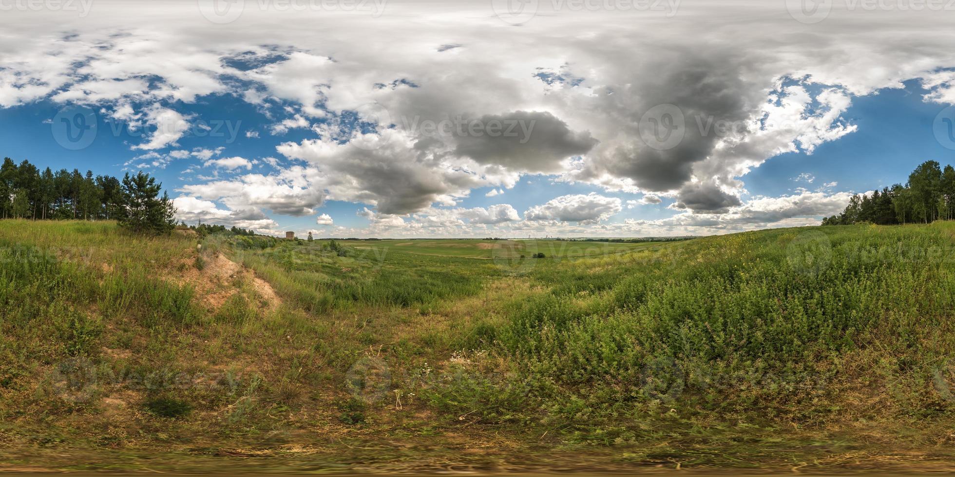 full 360 degree seamless panorama in equirectangular spherical equidistant projection. Panorama view  in a field in beautiful day with nice clouds. Background for virtual reality content photo