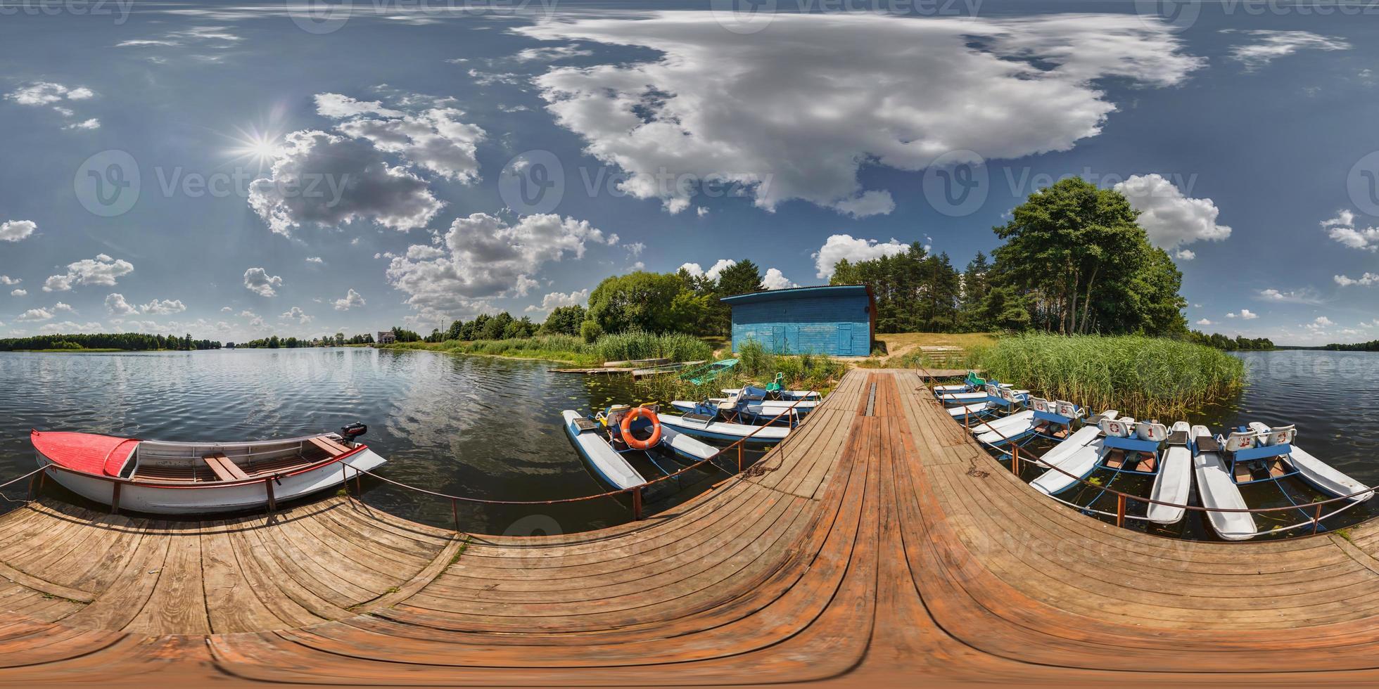 Boat station on the lake on a sunny day. Full 360 degree panorama in equirectangular spherical projection photo