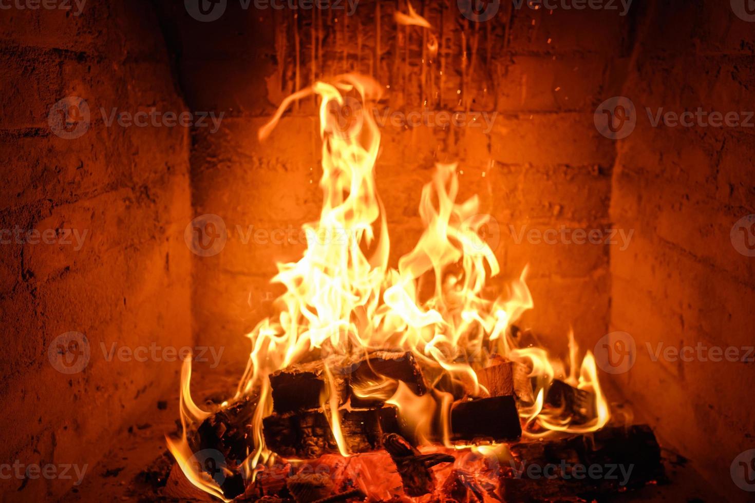 Fire flames in fireplace background photo