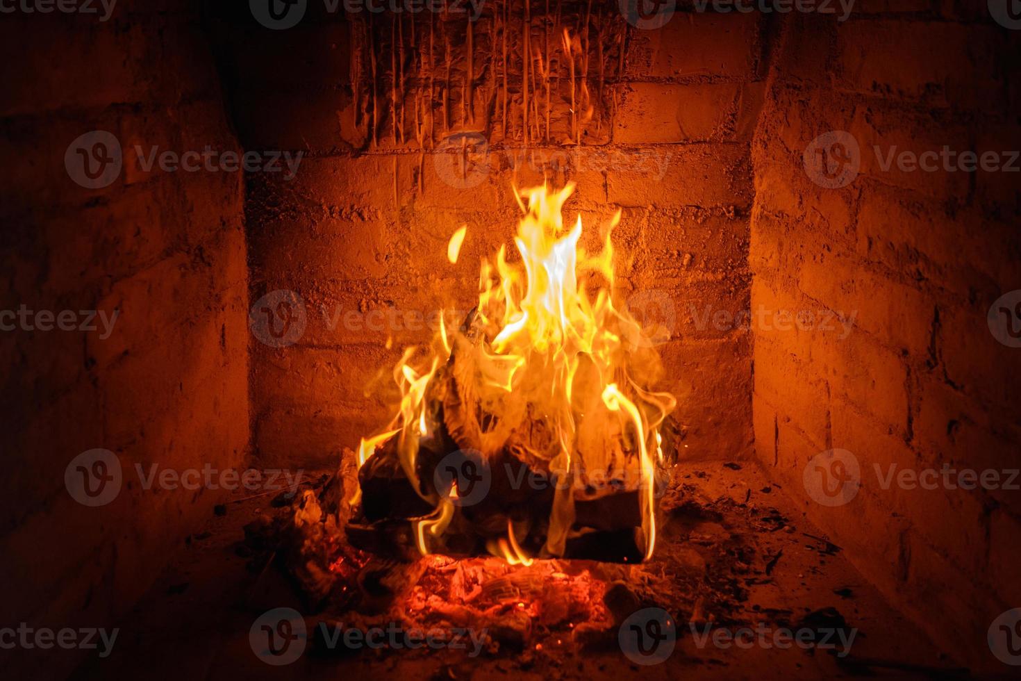 Fire flames in fireplace background photo