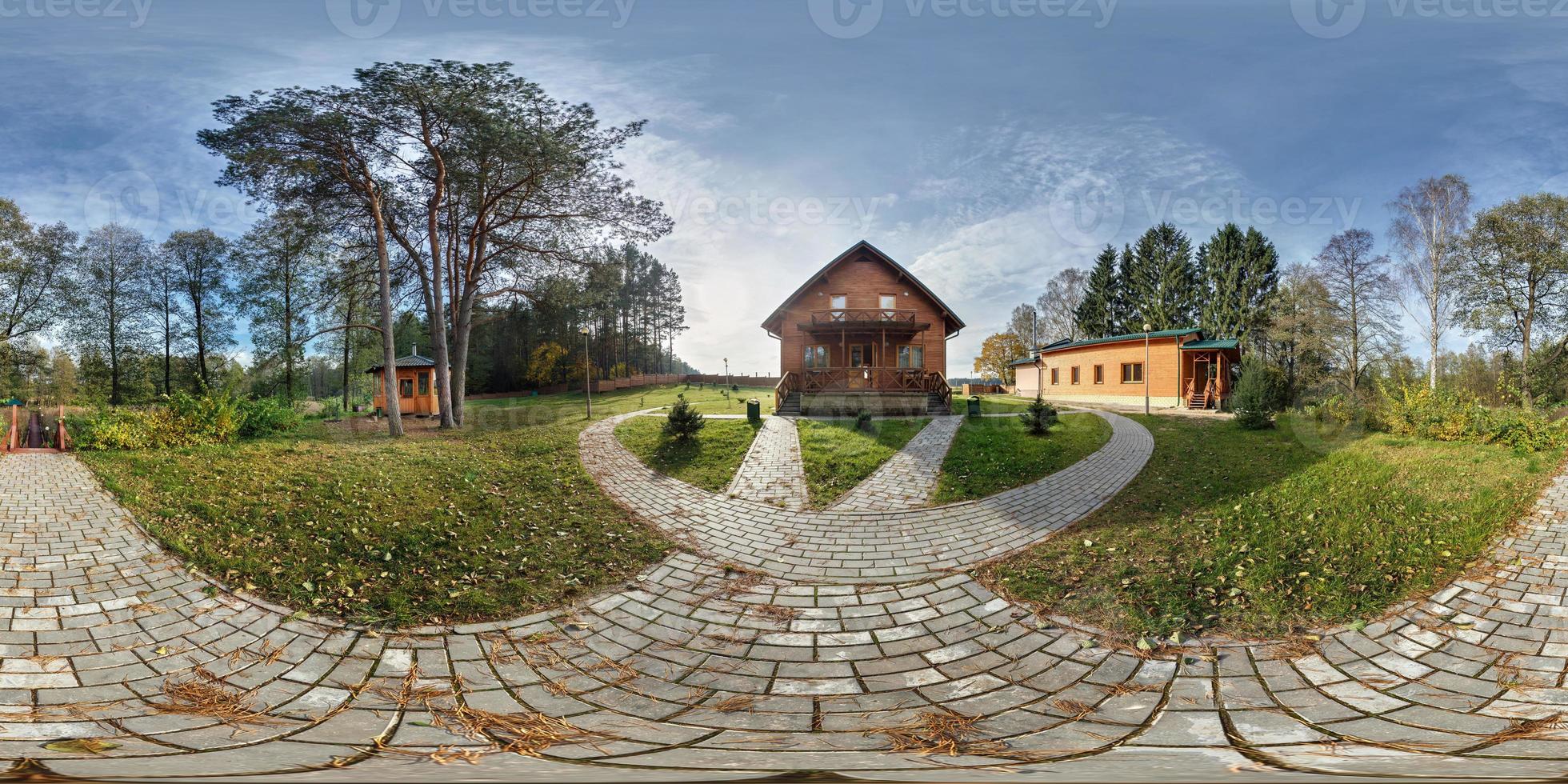 Full 360 degree seamless panorama in equirectangular spherical projection near vacation home in autumn evening forest. Skybox as background for virtual reality content photo