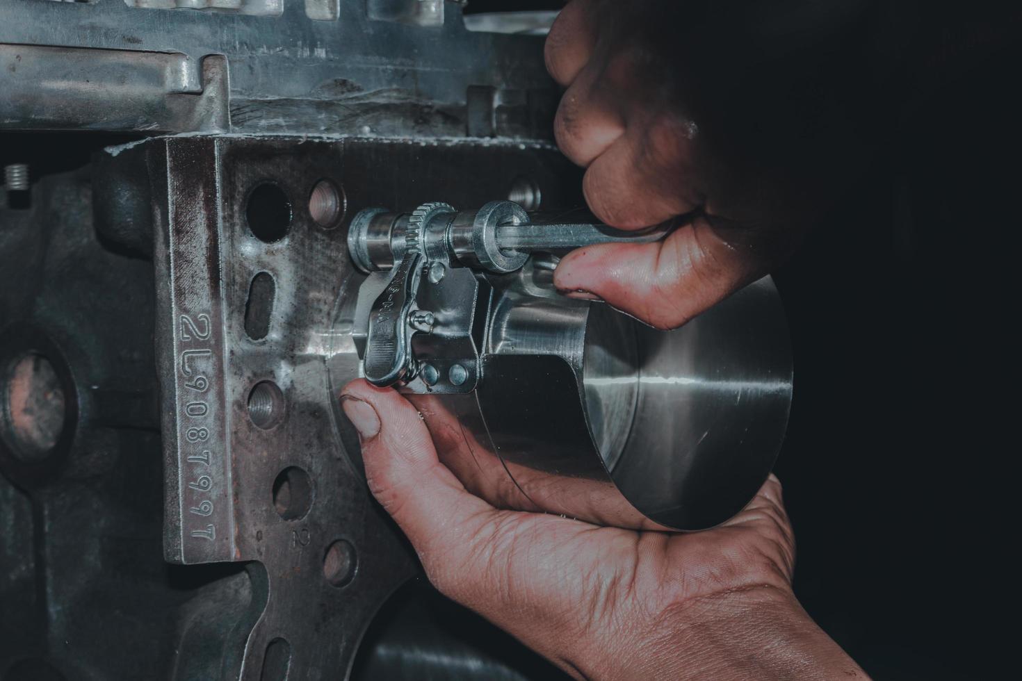 The mechanic is checking the engine. photo