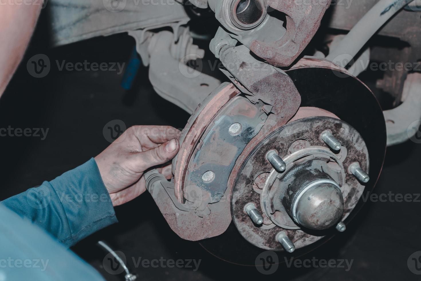 The mechanic is checking the engine. photo