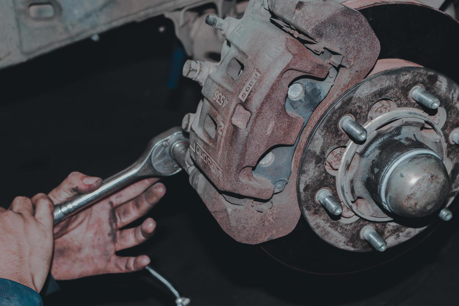 The mechanic is checking the engine. photo