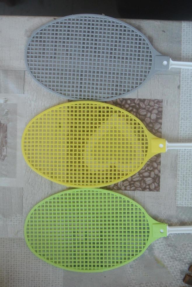 three  fly swappers on a table photo
