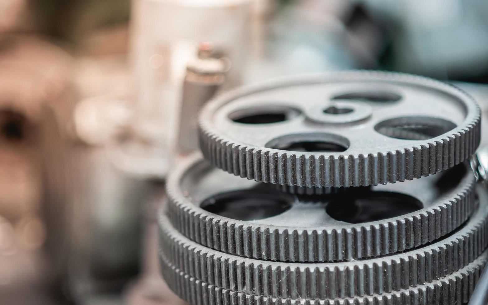 Machinery gears with oil stains and signs of use Lay the pile waiting for cleaning and maintenance. To make the machine work efficiently photo