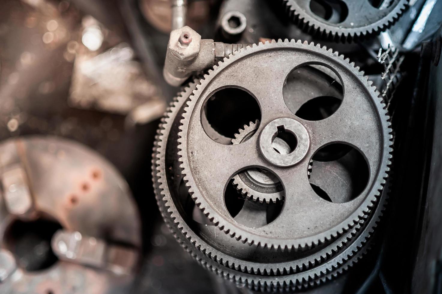 Machinery gears with oil stains and signs of use Lay the pile waiting for cleaning and maintenance. To make the machine work efficiently photo