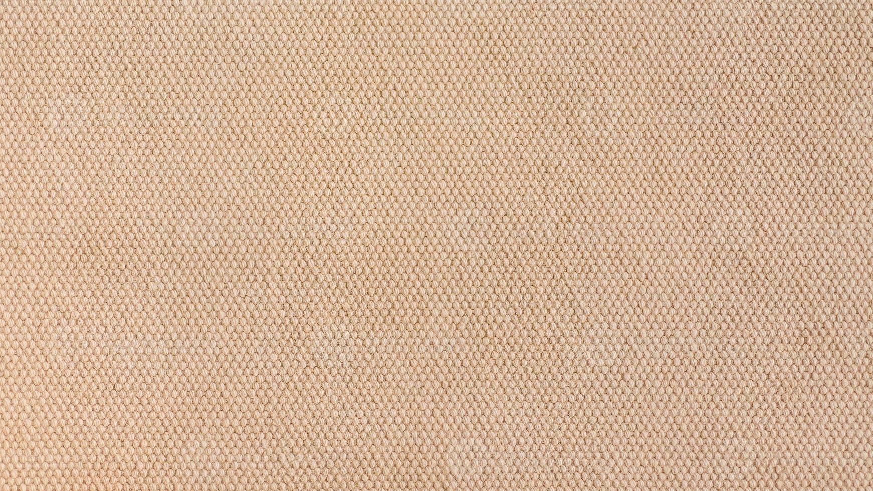 close-up Texture of light brown canvas fabric as background photo